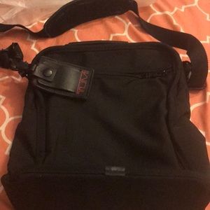 A man or woman’s travel bag  Name brand